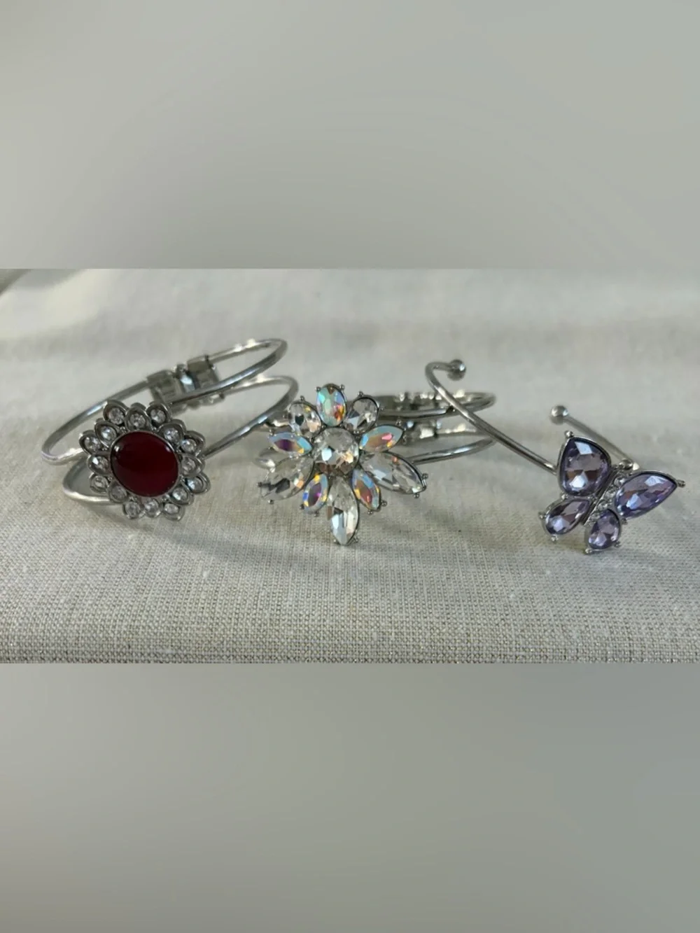Three silver tone bracelets.  Stylish and Glamorous